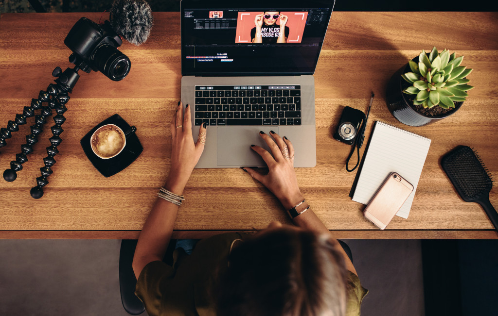 a woman editing a video on her laptop