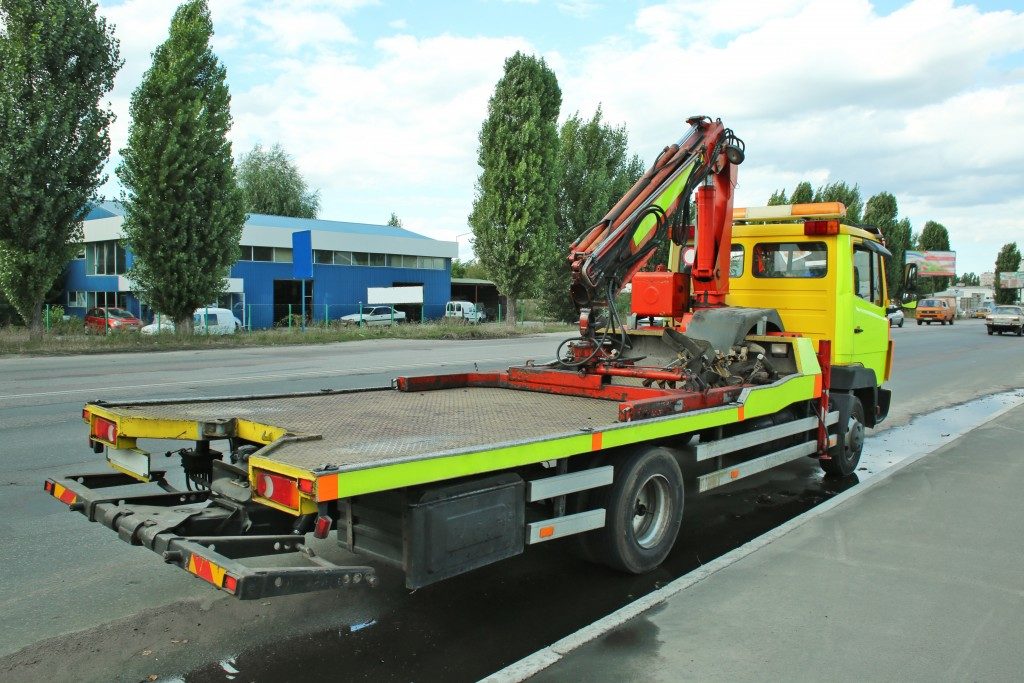 bright green tow truck on the street