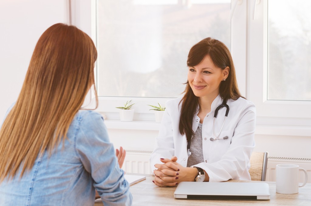 medical doctor with patient