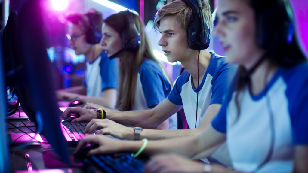 A team of multi-gender pro gamers playing competitively