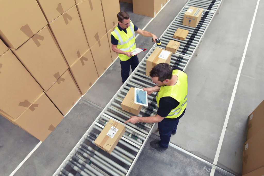 warehouse employees scanning using technology
