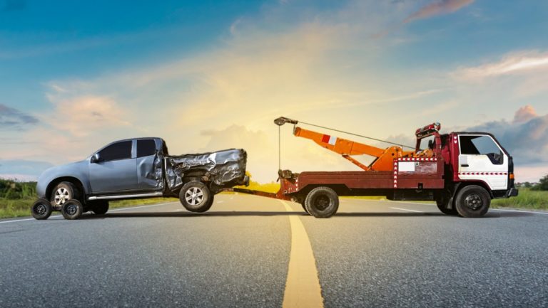 tow truck and a crashed vehicle