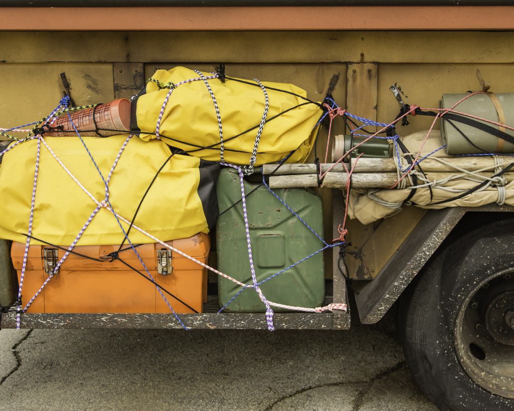 hunting gear strapped onto a small car