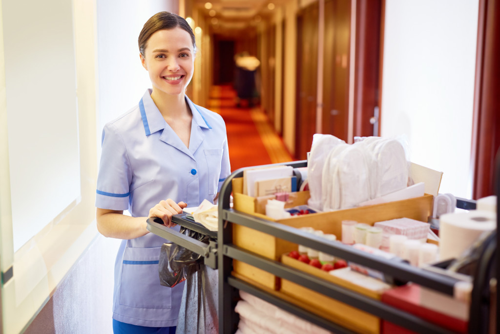 A hotel staff bringing room supplies around the hotel