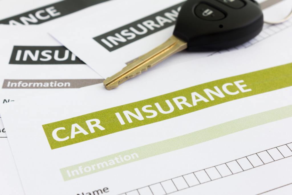 Car insurance form with car key