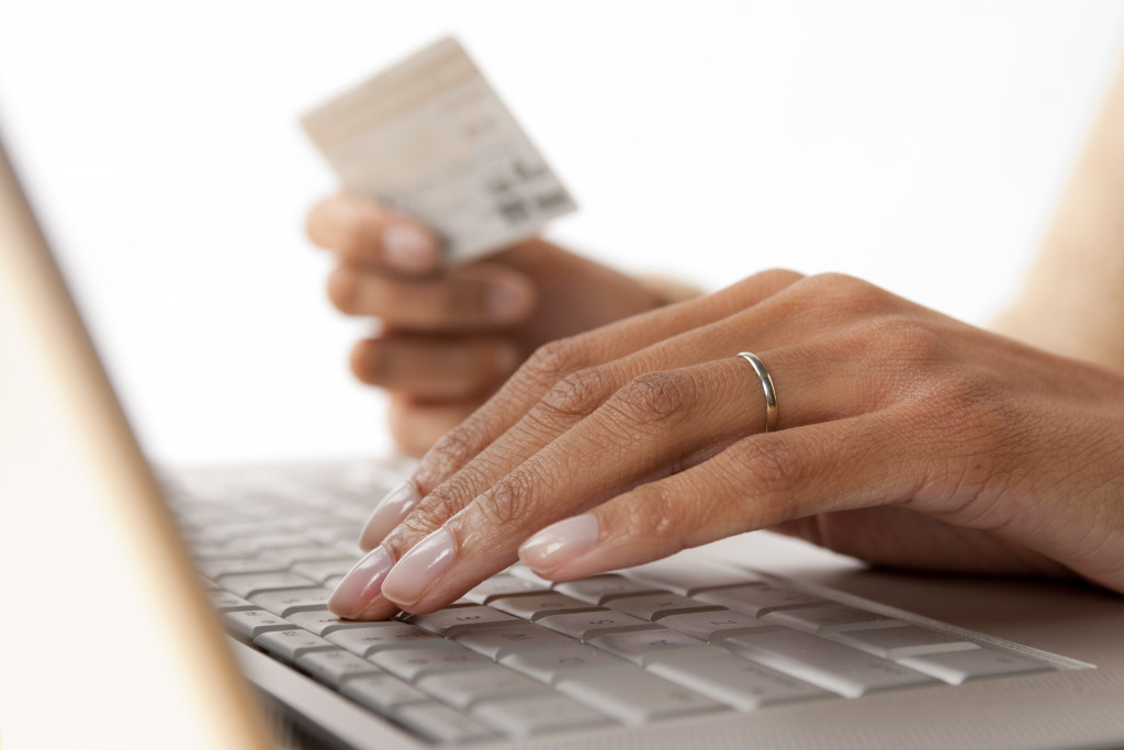 person typing on keyboard