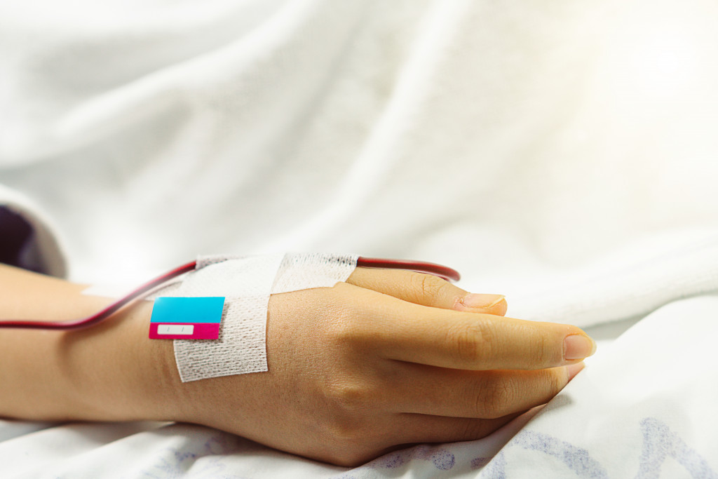 a hand with an intravenous medication