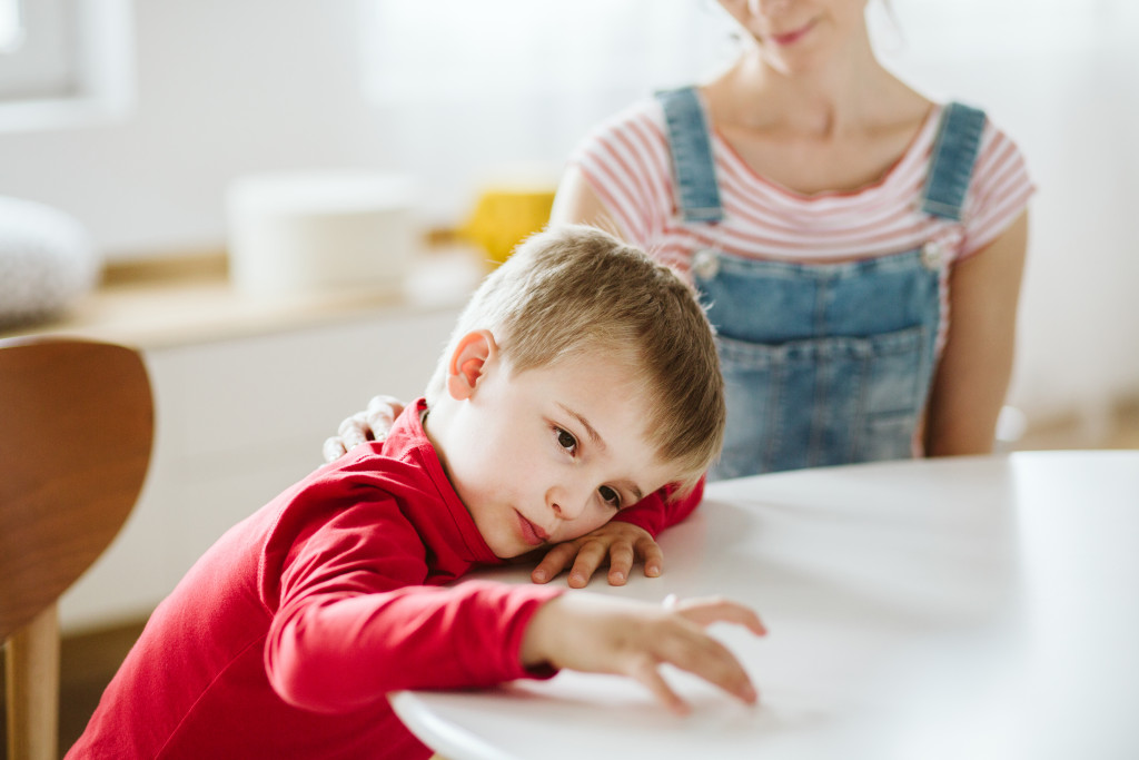 Kid with ADHD don't paying attention to his mother