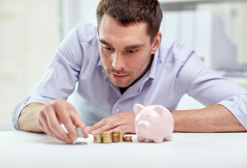 a person counting coins