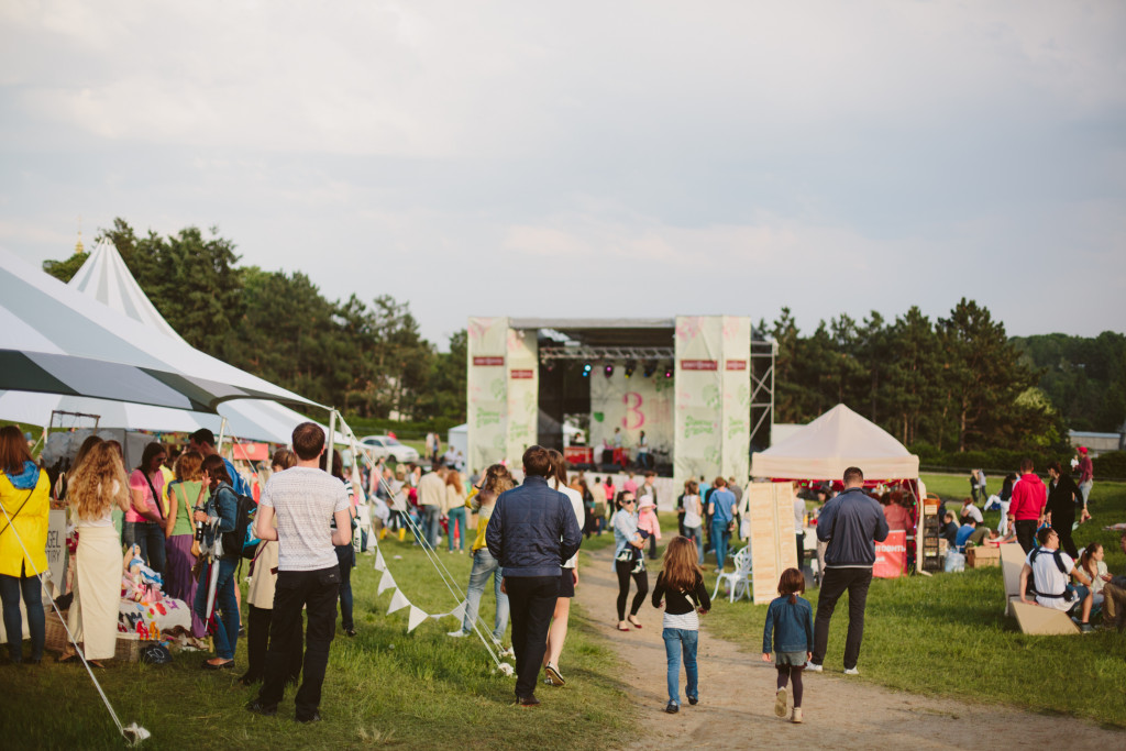 people hanging around an open air concert